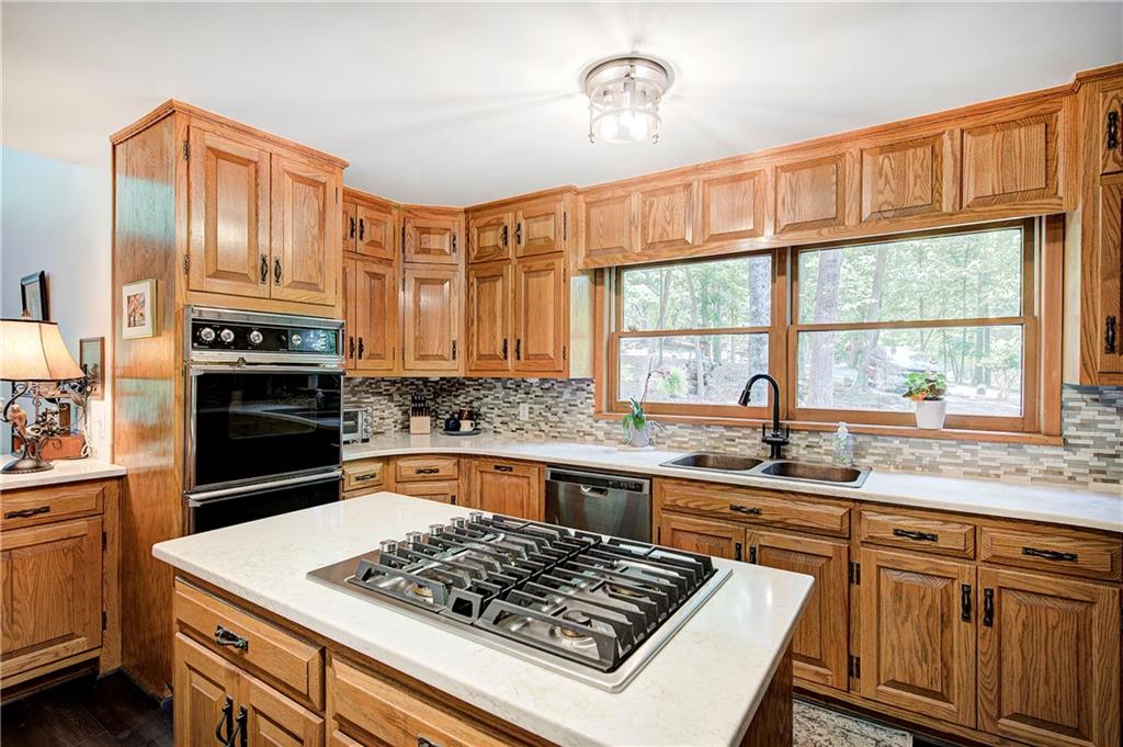 12 Tamarack Point Jasper, GA 30143 - Photo 18 of 83 a kitchen with stainless steel appliances granite countertop a sink stove and refrigerator