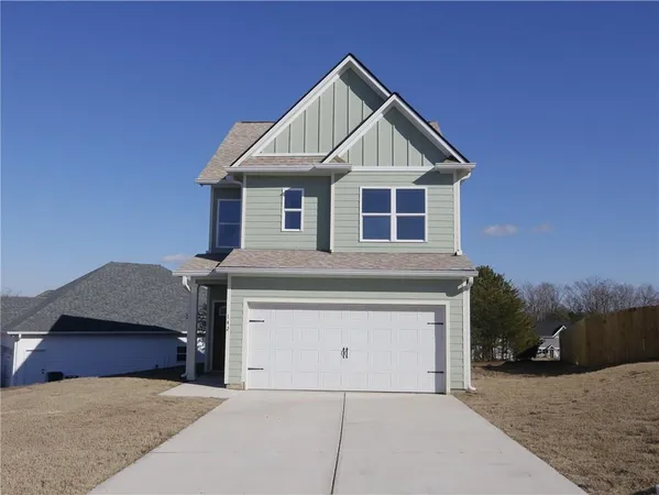 a front view of a house with garage