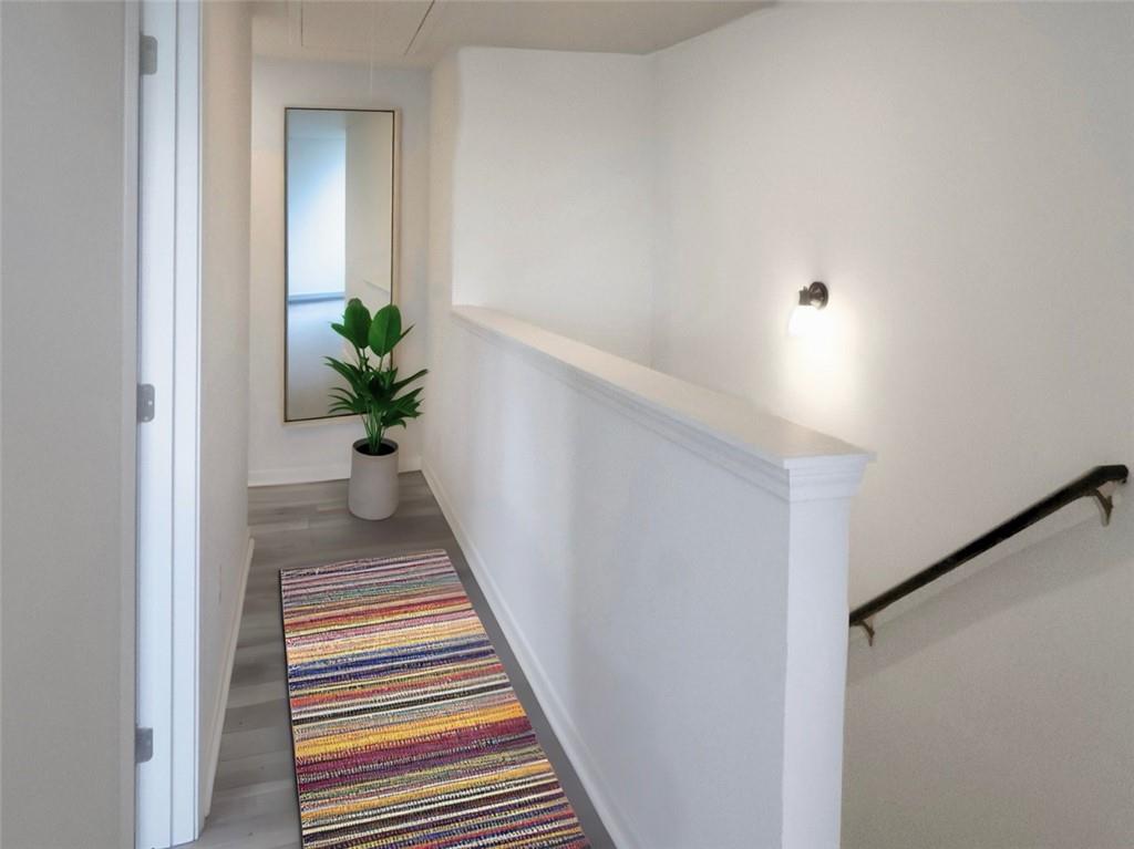 142 Pinto Lane Fairmount, GA 30139 - Photo 11 of 20 a view of a hallway with wooden floor and a potted plant