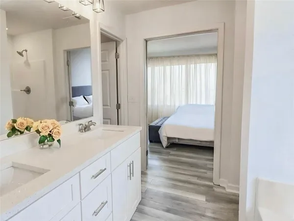a en suite bathroom with a sink and a mirror
