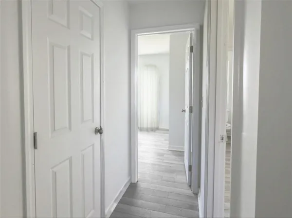 a view of a bathroom from the hallway