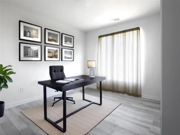 a workspace with furniture and a window