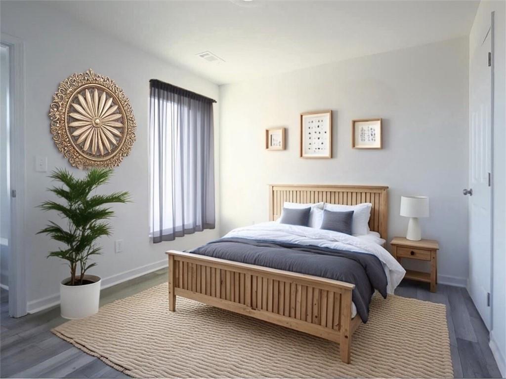142 Pinto Lane Fairmount, GA 30139 - Photo 17 of 20 a bedroom with a bed and a potted plant