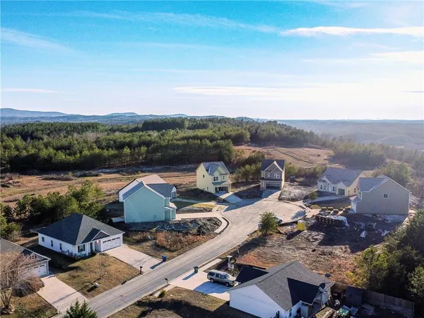 an aerial view of a house with outdoor space