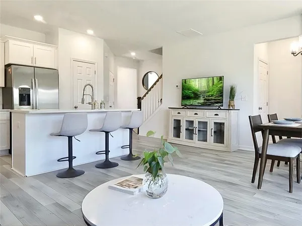 a living room with fireplace furniture and a flat screen tv