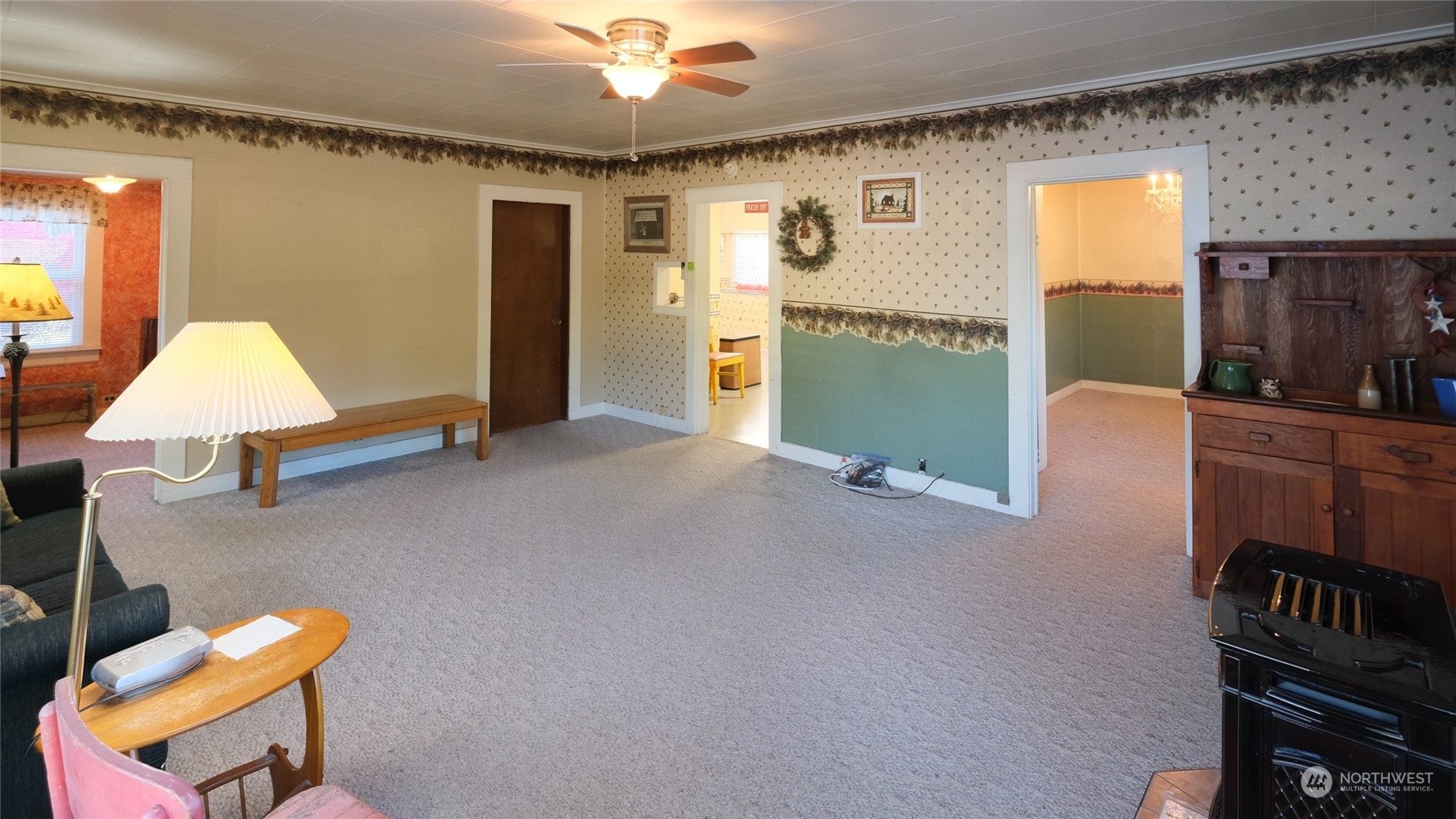 1146 Koontz Road Chehalis, WA 98532 - Photo 18 of 39 a living room with furniture and a chandelier