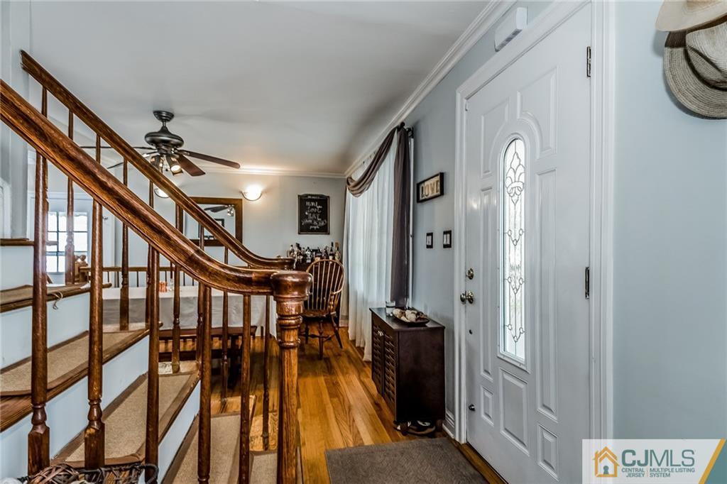 34 Wilcox Road New Brunswick, NJ 08901 - Photo 4 of 24 a view of an entryway with wooden floor and stairs