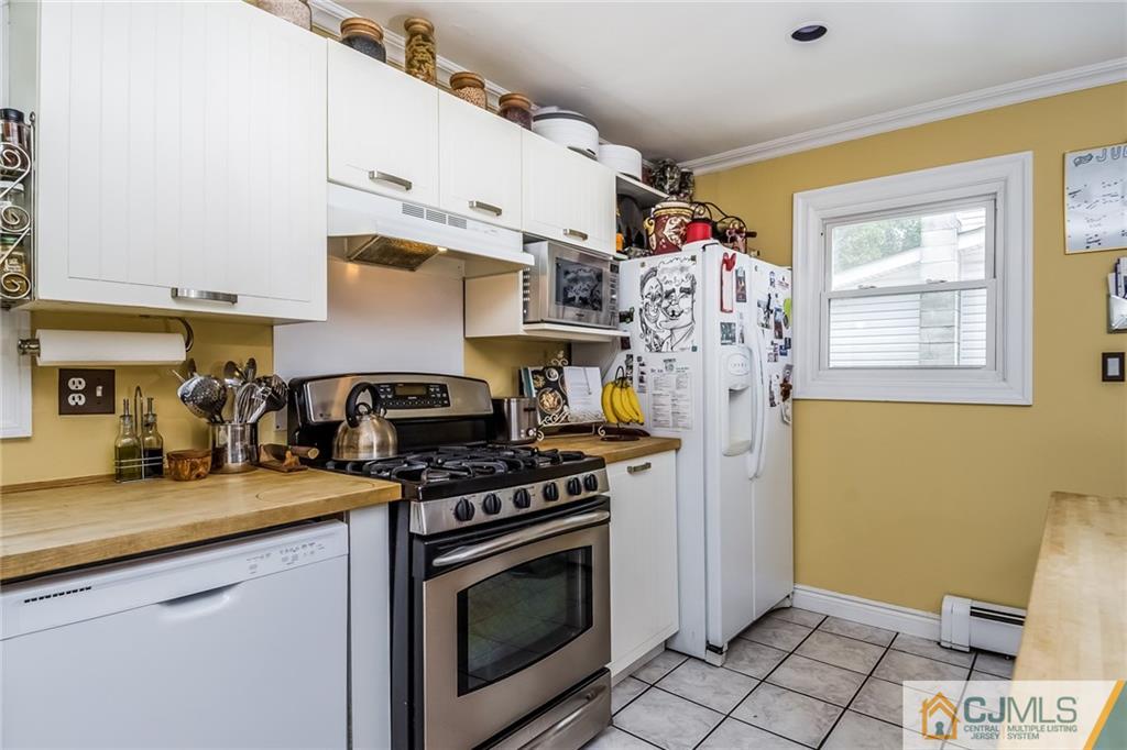 34 Wilcox Road New Brunswick, NJ 08901 - Photo 9 of 24 a kitchen with stainless steel appliances granite countertop a stove and a sink