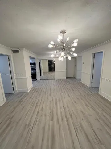 a view of a livingroom with a kitchen