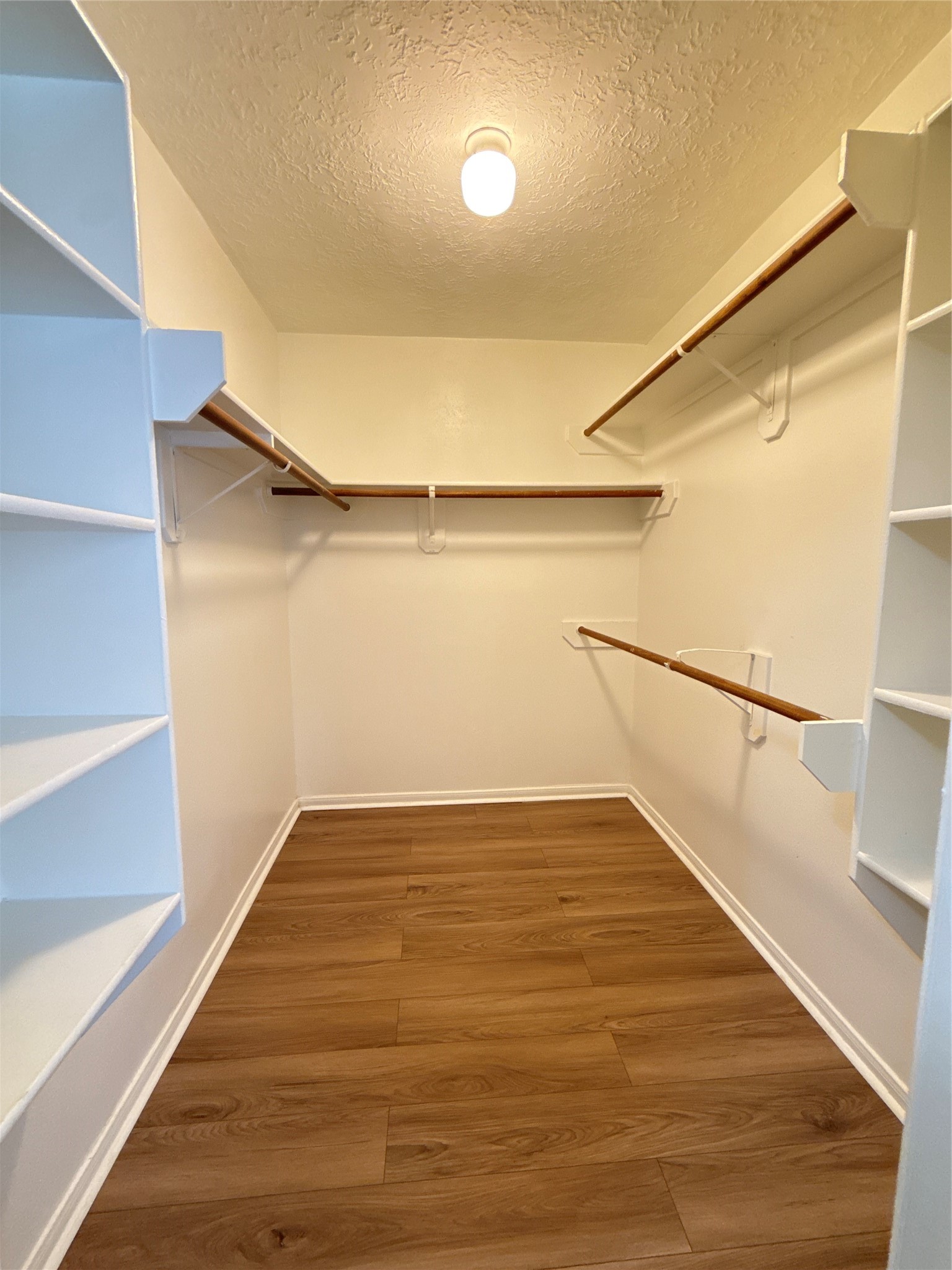 15919 Hiram Clarke Road Houston, TX 77053 - Photo 25 of 29 a view of an empty room with wooden floor and stairs