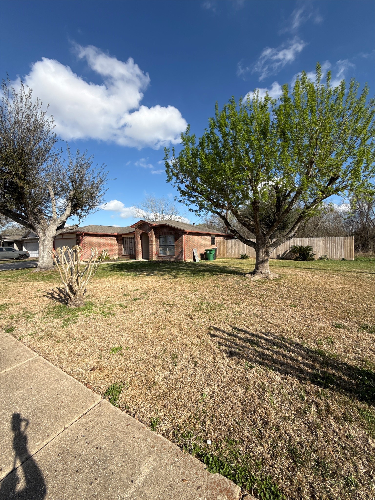15919 Hiram Clarke Road Houston, TX 77053 - Photo 3 of 29 a front view of a house with a yard
