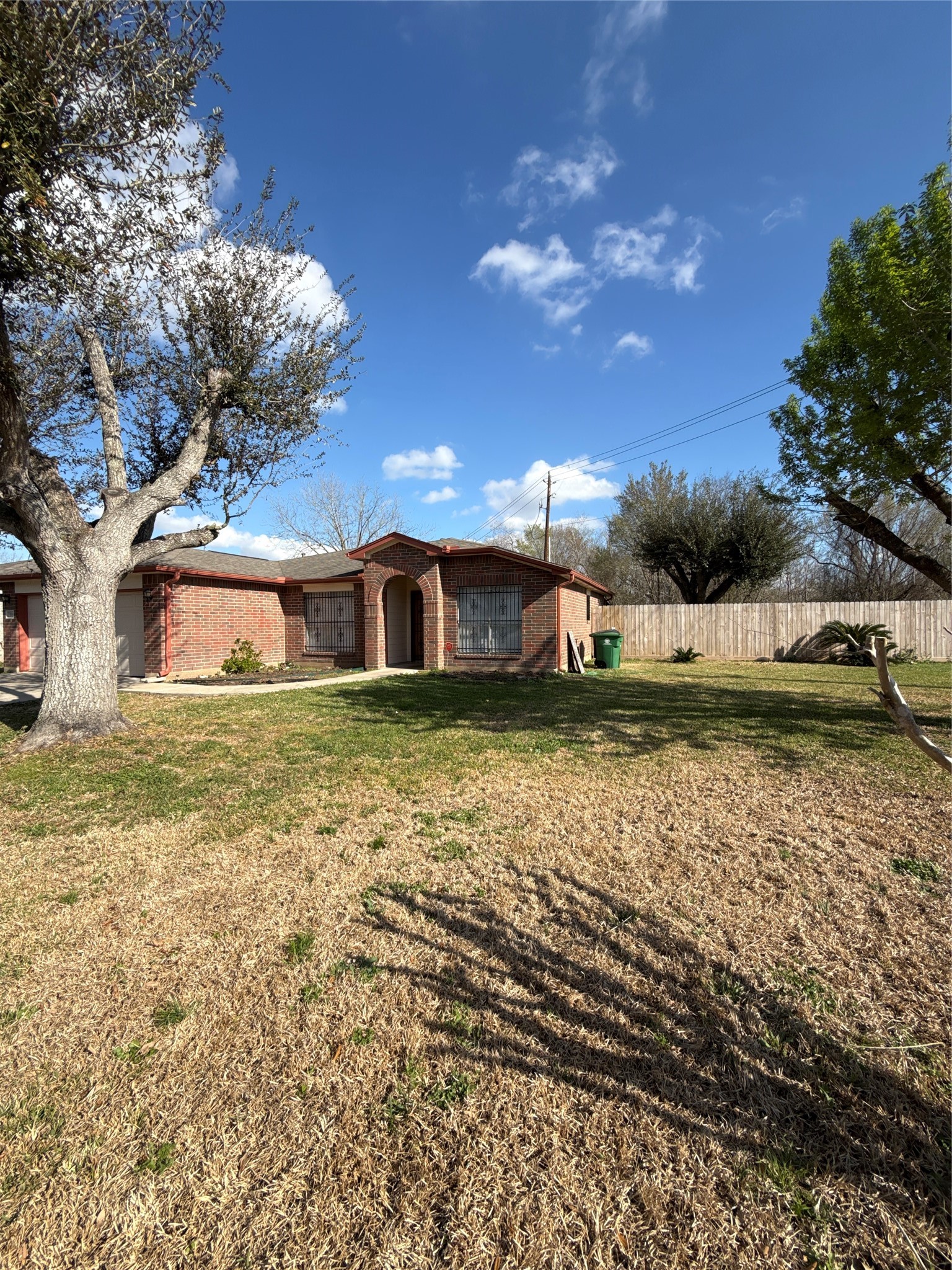 15919 Hiram Clarke Road Houston, TX 77053 - Photo 4 of 29 a front view of a house with a yard