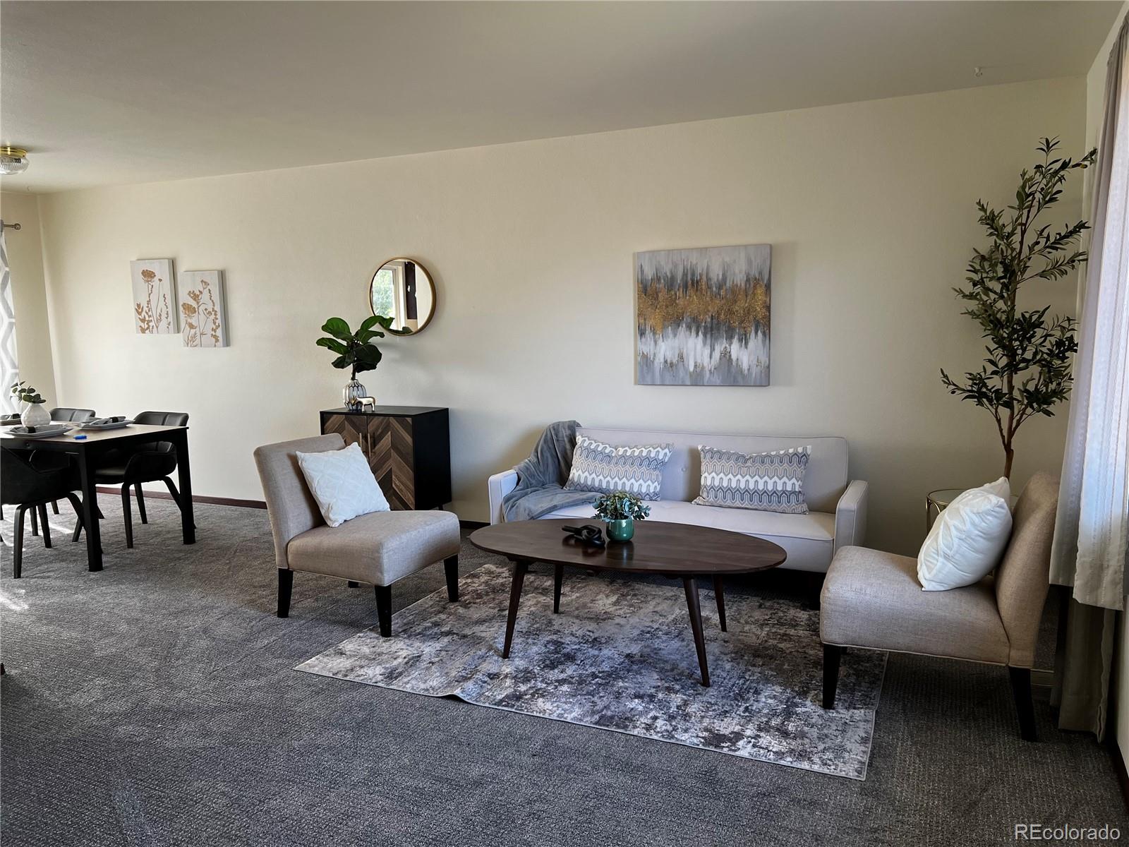 1810 Winnebago Road Colorado Springs, CO 80915 - Photo 3 of 19 a living room with furniture and a potted plant