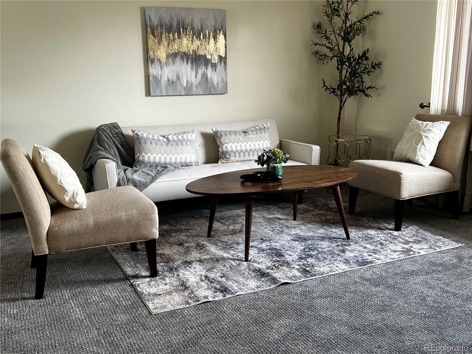 1810 Winnebago Road Colorado Springs, CO 80915 - Photo 4 of 19 a living room with furniture a table and a potted plant