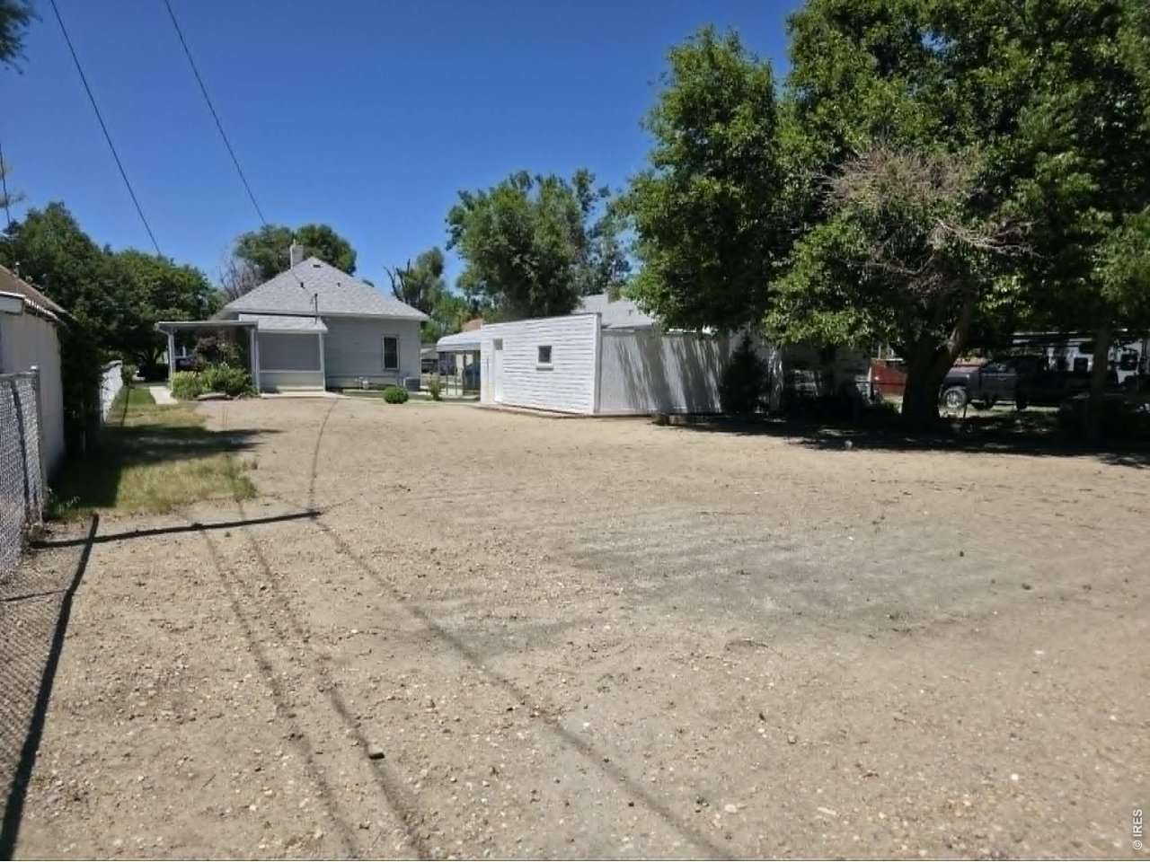 218 Maple Street Fort Morgan, CO 80701 - Photo 14 of 48 Back yard is fully fenced on three sides, Just needs fencing along the driveway and back patio