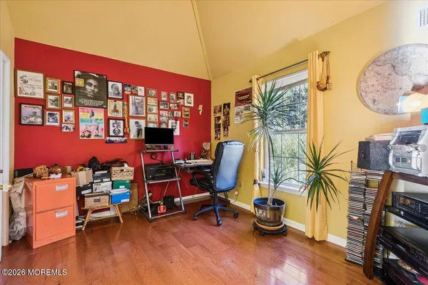 a bathroom with a sink and mirror with bathtub