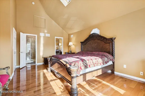 a living room with furniture a rug and a wall painting