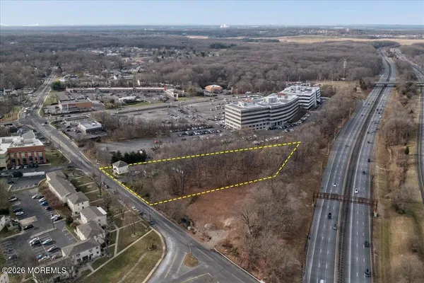 a living room with furniture a rug and a flat screen tv