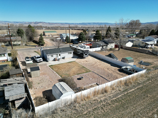 1852 East 3500th Street South Vernal, UT 84078 - Photo 37 of 46 Aerial view of residential backyard area with a mountain backdrop