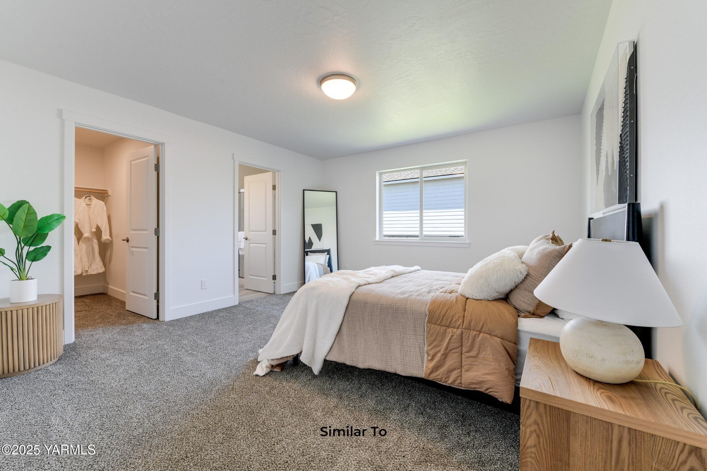 701 Vineyard Street, Unit PHASE 2 LOT 22) SPEC Grandview, WA 98930 - Photo 17 of 22 a bedroom with a bed and a window