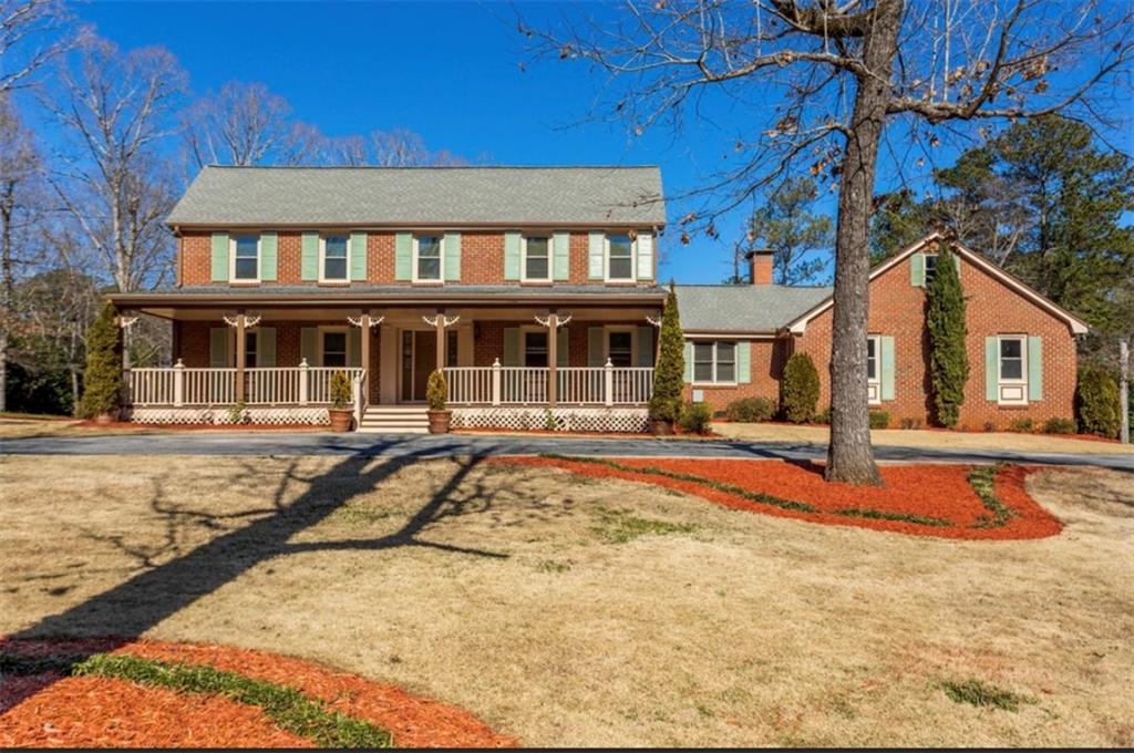 5596 Hugh Howell Road Stone Mountain, GA 30087 - Photo 1 of 1 a house view with a outdoor space