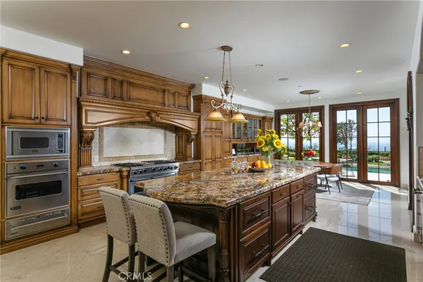 a kitchen with a stove a sink and a refrigerator