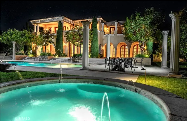 a view of swimming pool with a yard