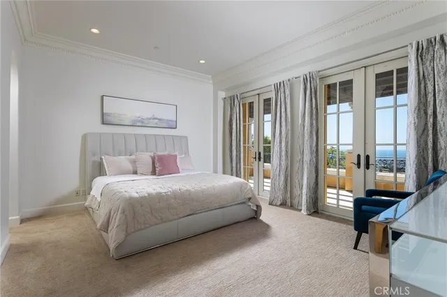 a en suite bathroom with a granite countertop sink and a mirror