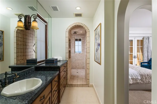 a bedroom with furniture and a fireplace