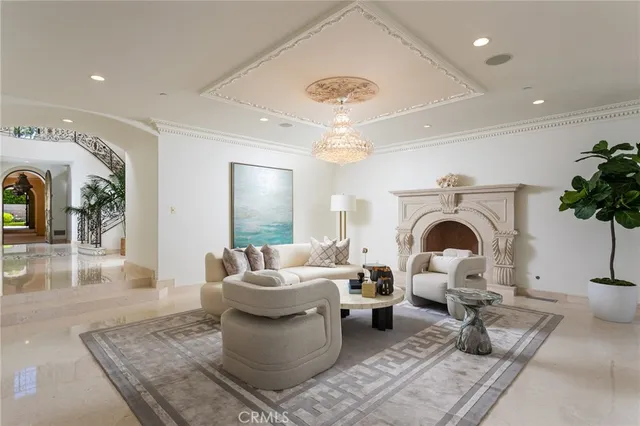 a living room with furniture a rug and a fireplace