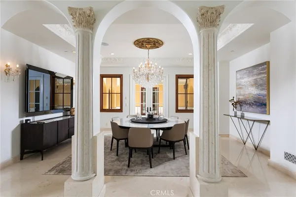 a dining room with furniture and window
