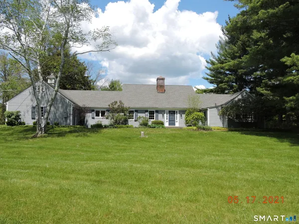 a view of a house with a big yard