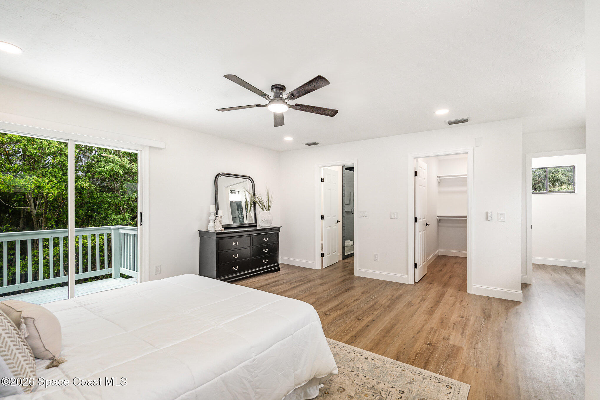 362 Nikomas Way Melbourne Beach, FL 32951 - Photo 12 of 32 a bedroom with a bed and a dresser