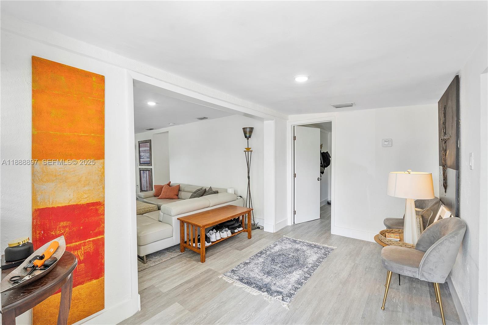 1101 Northwest 40th Street Miami, FL 33127 - Photo 15 of 31 a living room with furniture and a table