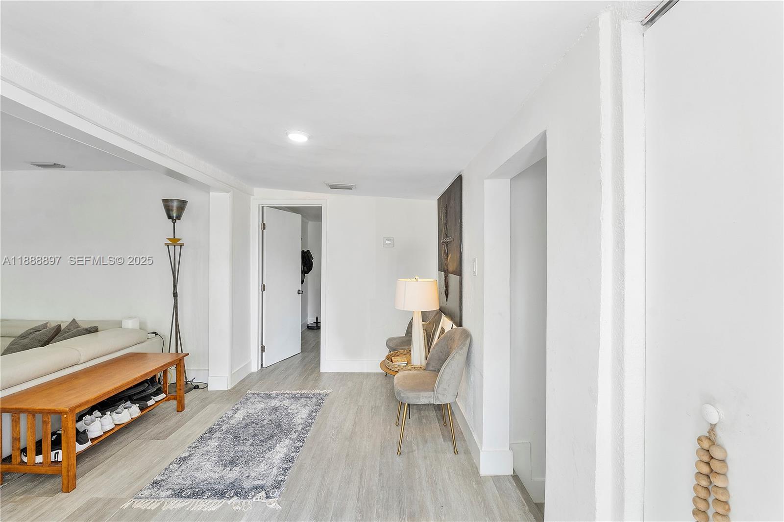 1101 Northwest 40th Street Miami, FL 33127 - Photo 21 of 31 a view of a bedroom with furniture and staircase