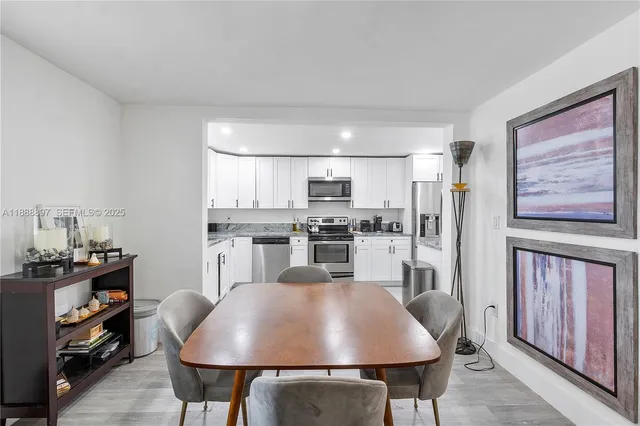 a view of a dining room with furniture and window