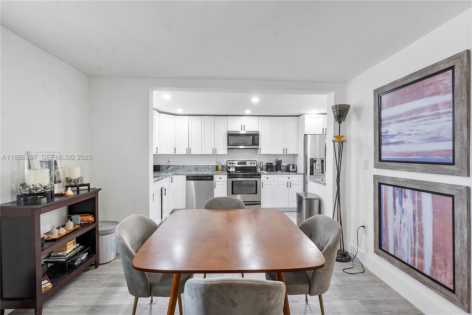 1101 Northwest 40th Street Miami, FL 33127 - Photo 8 of 31 a view of a dining room with furniture and window