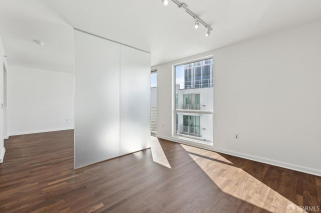 a view of a hallway with washer and dryer