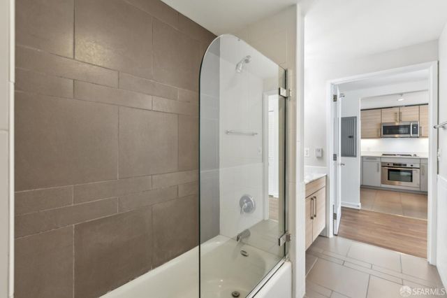 a bedroom with a bed and a lamp