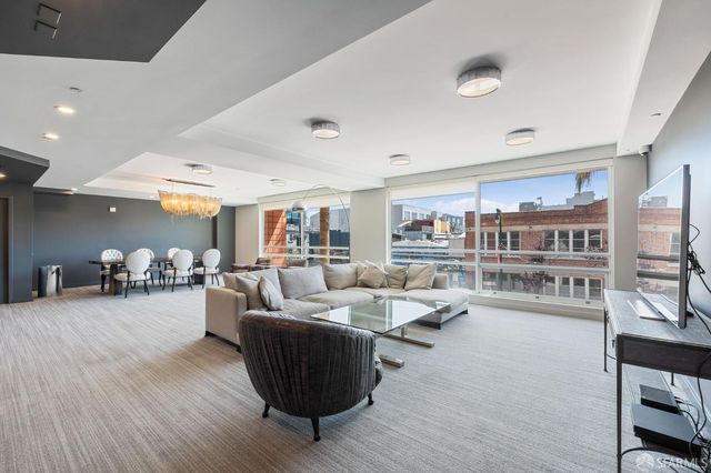 a outdoor space with lots of furniture and potted plants