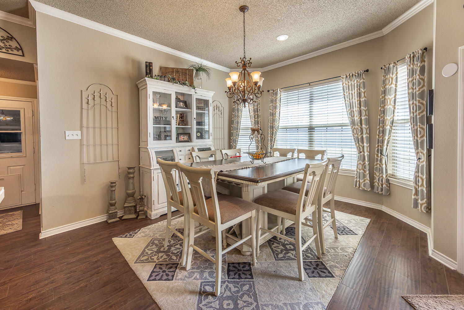 6309 County Road 7470 Lubbock, TX 79424 - Photo 11 of 41 a view of a dining room with furniture window and wooden floor