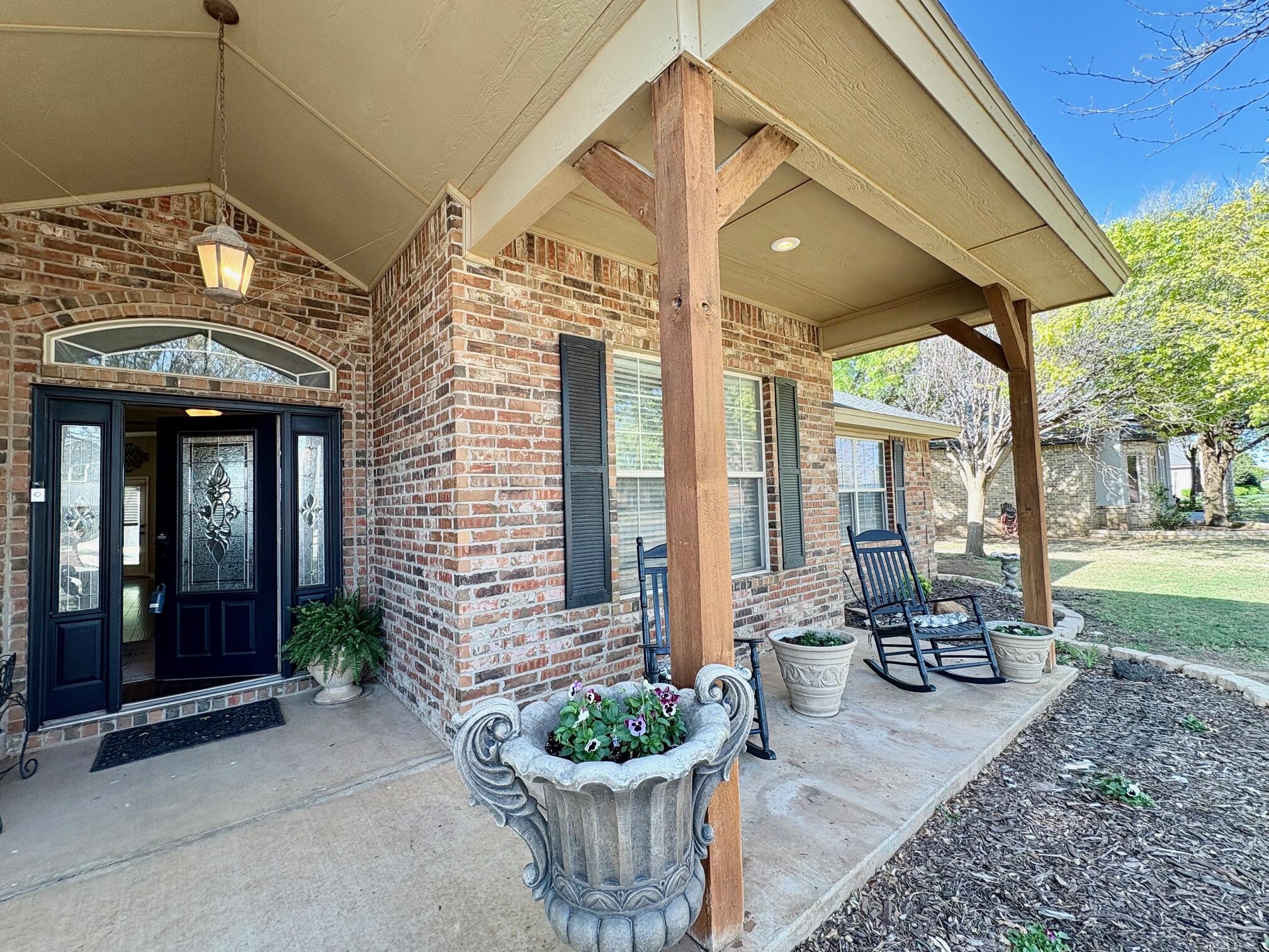 6309 County Road 7470 Lubbock, TX 79424 - Photo 2 of 41 a front view of a house with a fountain