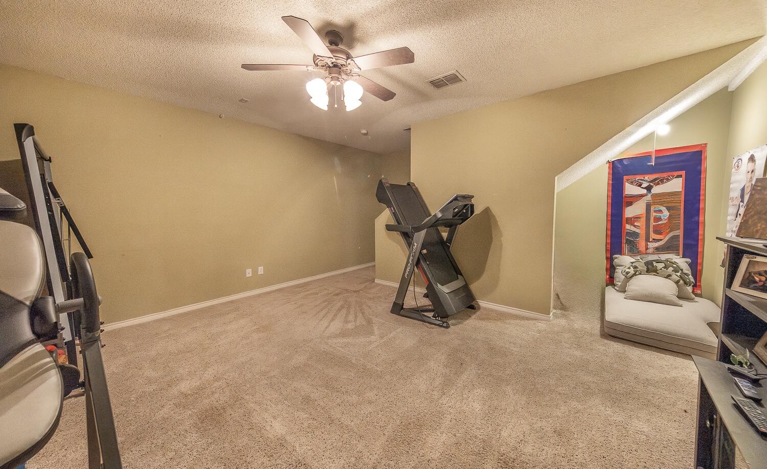 6309 County Road 7470 Lubbock, TX 79424 - Photo 26 of 41 a view of a room with gym equipment