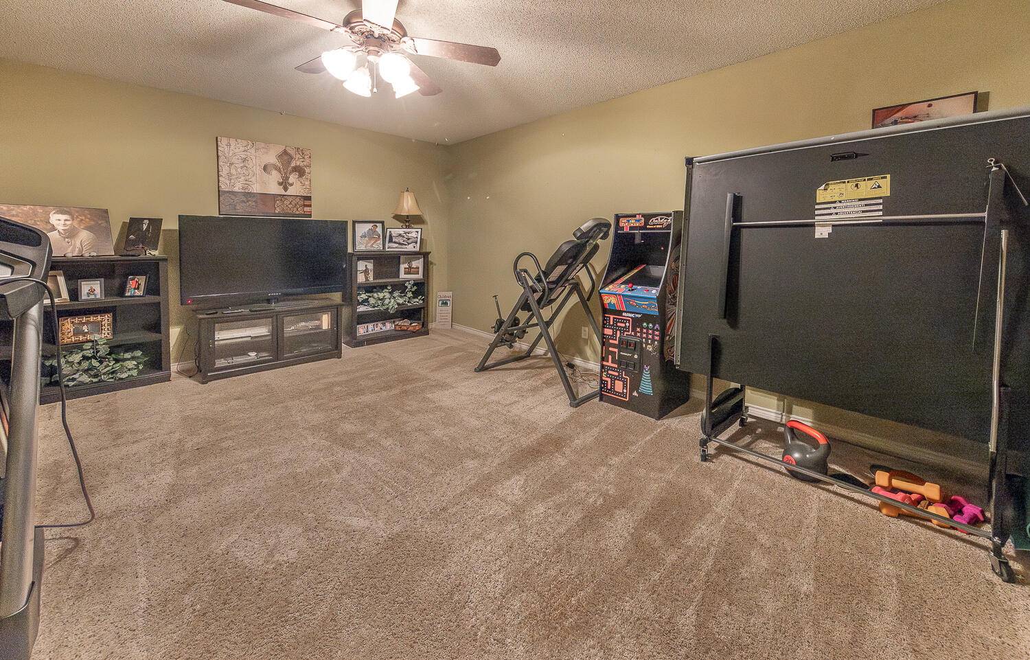6309 County Road 7470 Lubbock, TX 79424 - Photo 27 of 41 a view of a livingroom with furniture and a flat screen tv