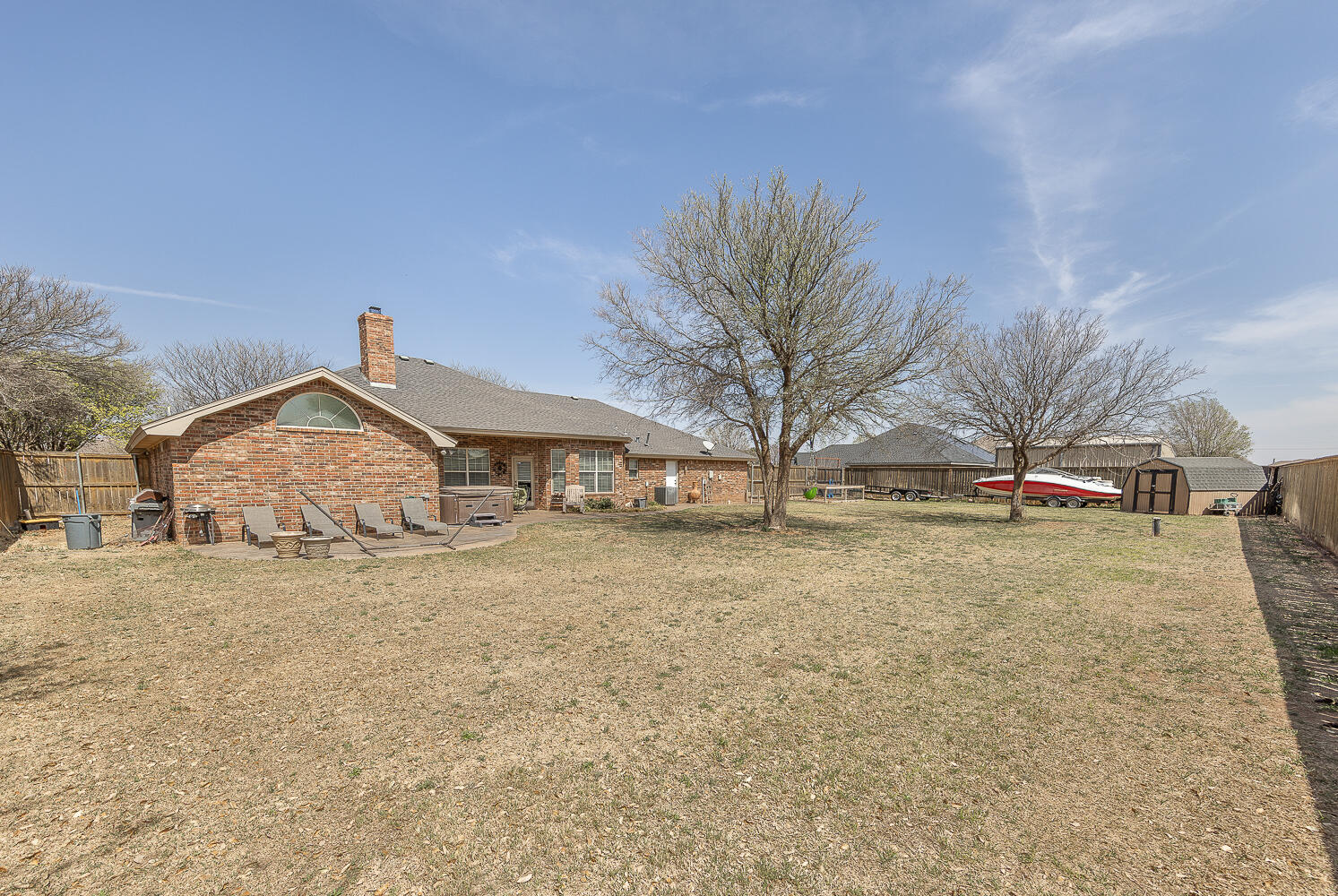 6309 County Road 7470 Lubbock, TX 79424 - Photo 31 of 41 a front view of a house with a yard and garage