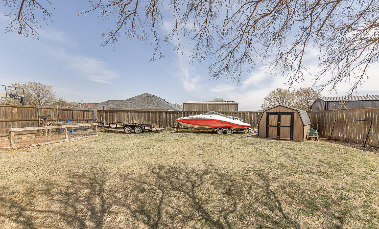 6309 County Road 7470 Lubbock, TX 79424 - Photo 33 of 41 a front view of a house with a yard and trees