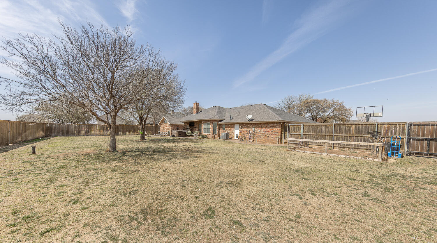 6309 County Road 7470 Lubbock, TX 79424 - Photo 35 of 41 a view of a house with a yard