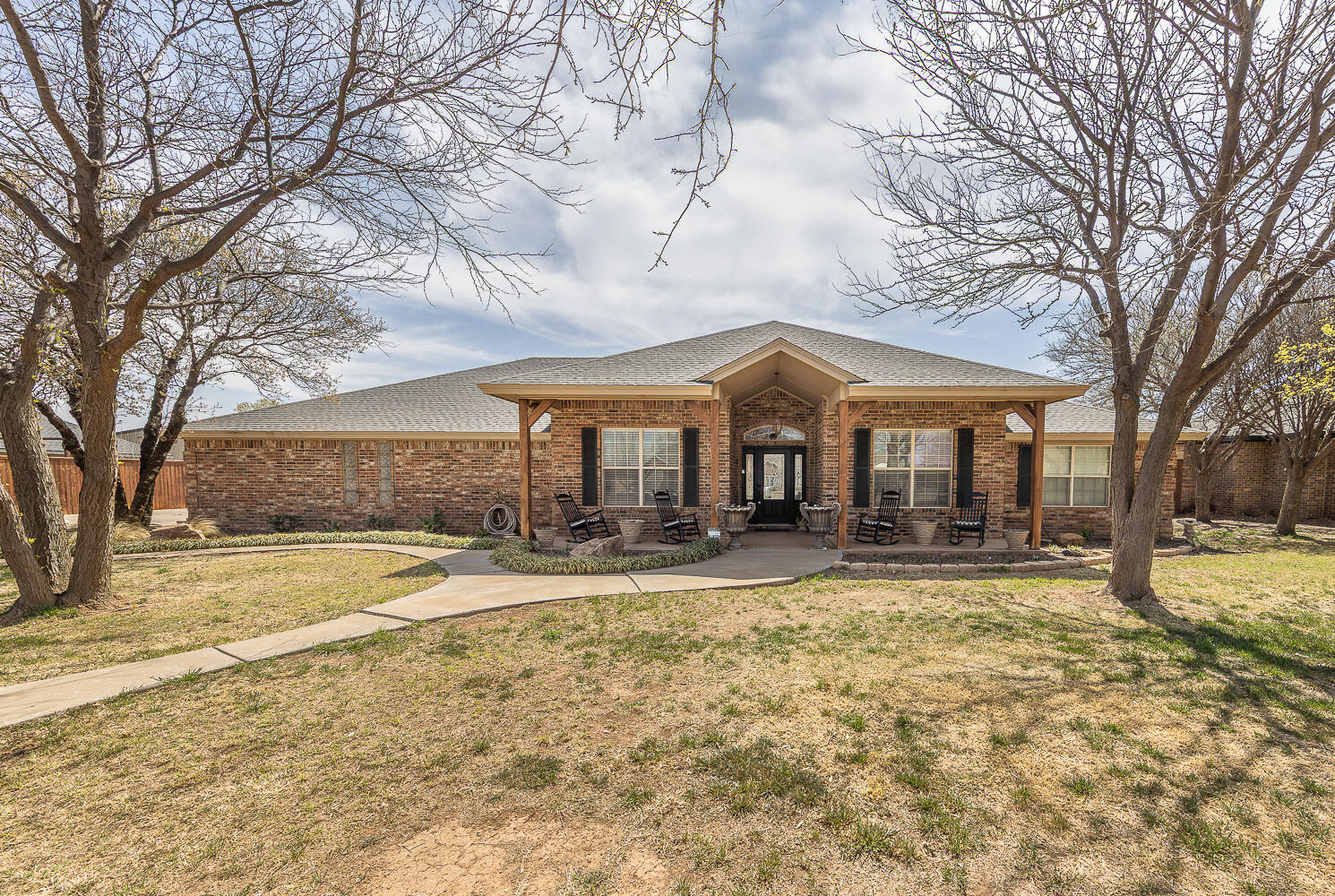 6309 County Road 7470 Lubbock, TX 79424 - Photo 38 of 41 a view of a house with a yard and large tree