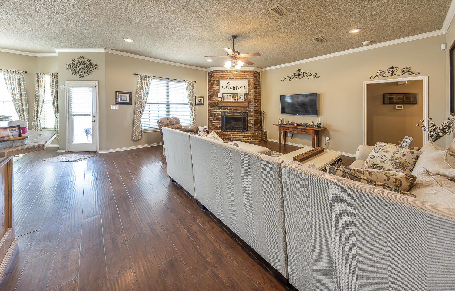 6309 County Road 7470 Lubbock, TX 79424 - Photo 5 of 41 a living room with furniture and a flat screen tv