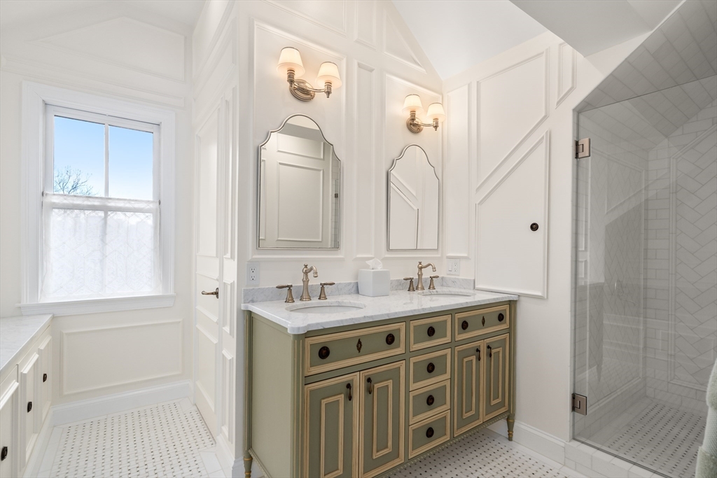 19 Charles Street Boston, MA 02129 - Photo 12 of 28 a bathroom with a double vanity sink mirror and